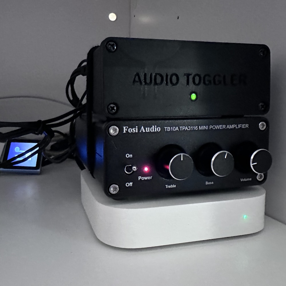 The finished device, hooked up. I've got an Airport Express (for AirPlay) on one input and an old iPod perpetually playing a 12 hour white noise loop on another.